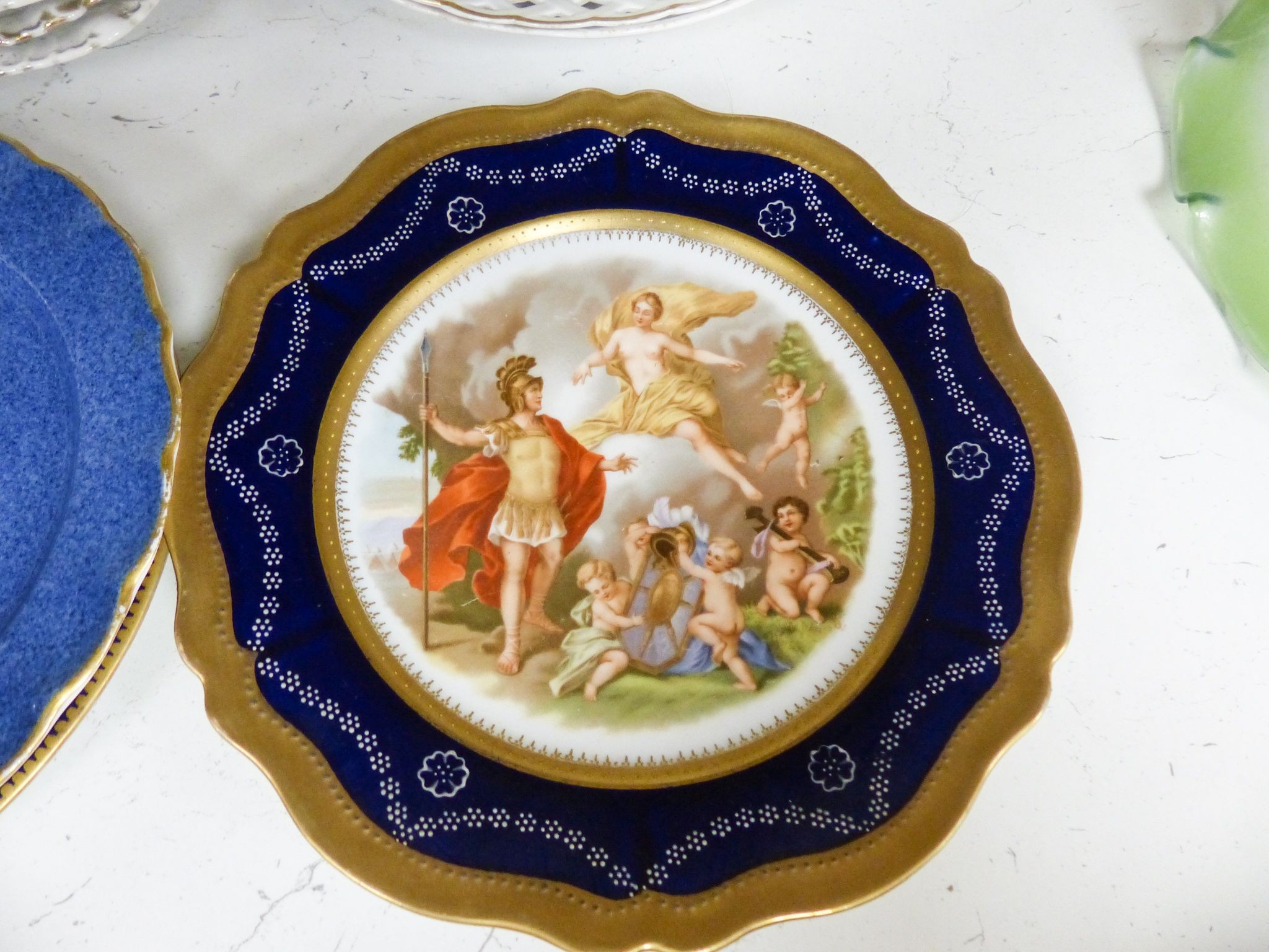 A collection of 19th/20th century Continental porcelain wall plates including a Royal Worcester powder blue fruit painted plate signed W. Bee, 23cm